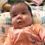 Baby Saleha in pink sleeper outfit