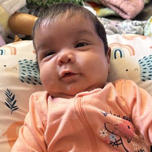 Baby Saleha in pink sleeper outfit