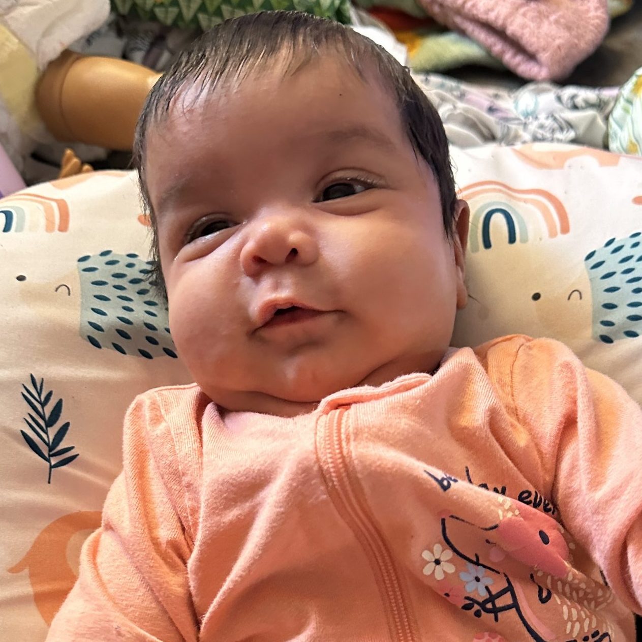 Baby Saleha in pink sleeper outfit